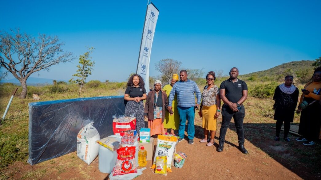 Inyatsi Foundation representatives pose with Gogo Manoma Langwenya and her family after donating food parcels and sleeping sponge to the household in Matsanjeni South. Photo: Inyatsi Foundation