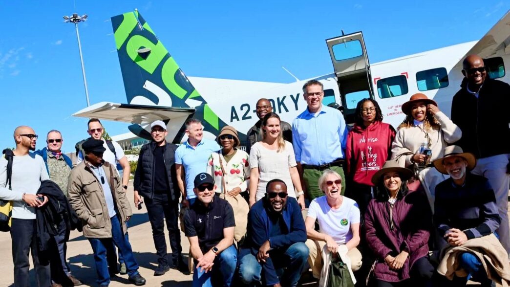 AviaDev Africa 2026 delegates representing 11 airlines from across the globe pose for a group photo during their networking excursion to the Okavango Delta in Botswana. | Photo: Botswana Tourism