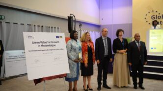 European Union and Mozambican officials stand alongside one of the agreement cheques during the signing ceremony at the Mozambique-EU Business Forum 2026 in Maputo, where four deals worth €178 million were signed to boost clean energy, digital inclusion, agriculture, and education. | Photo: X/@MaggioreEU