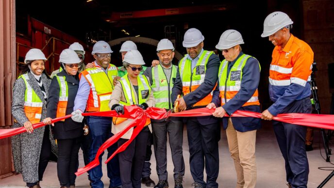 Transnet board members, executives, government representatives, industry stakeholders and project partners gather at the Saldanha Iron Ore Terminal to mark the start of testing and commissioning of the new tippler, a key milestone in a R4 billion expansion project at Africa's largest iron ore export facility. (Photo: Transnet)