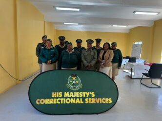 Superintendent Nokuthula Zwane with the (CMOs) during the closing of the Introductory Case Management Course at Matsapha Correctional Centre. Photo by HMCS