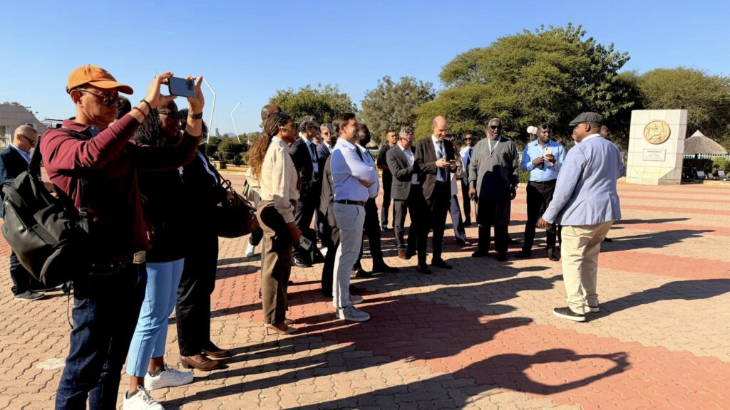 AviaDev Africa 2026 delegates pause for a photo at the iconic Three Dikgosi Monument in Gaborone, which honours Botswana's visionary traditional leaders, during a city tour held on the sidelines of the aviation forum on 10 June 2026. | Photo: Botswana Tourism