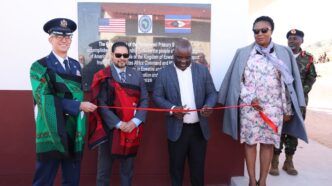Minister of Education and Training Honourable Owen Nxumalo and US Chargé d'Affaires Marc Weinstock cut the ribbon at the handover of newly built school facilities funded by the United States government. Photo: US Embassy Eswatini
