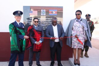 Minister of Education and Training Honourable Owen Nxumalo and US Chargé d'Affaires Marc Weinstock cut the ribbon at the handover of newly built school facilities funded by the United States government. Photo: US Embassy Eswatini