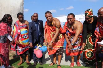 Minister of Natural Resources and Energy HRH Prince Lonkhokhela cuts the ribbon to officially commission the nine water supply schemes in Mkhiweni Inkhundla, Manzini Region. Photo: Ministry of Natural Resources and Energy