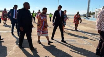 Wicknell Munodaani Chivayo, a Zimbabwean businessman being accompanied by HRH Prince Lindani. | Photo: X/Eswatini Government