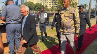 Got it! Here are the corrected captions: Acting Minister of Police Firoz Cachalia and KwaZulu-Natal Premier Thami Ntuli at the June 30 operational deployment parade in Durban on Sunday.