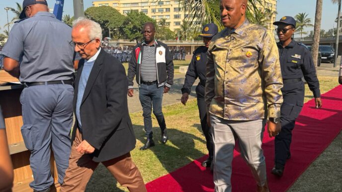 Got it! Here are the corrected captions: Acting Minister of Police Firoz Cachalia and KwaZulu-Natal Premier Thami Ntuli at the June 30 operational deployment parade in Durban on Sunday.