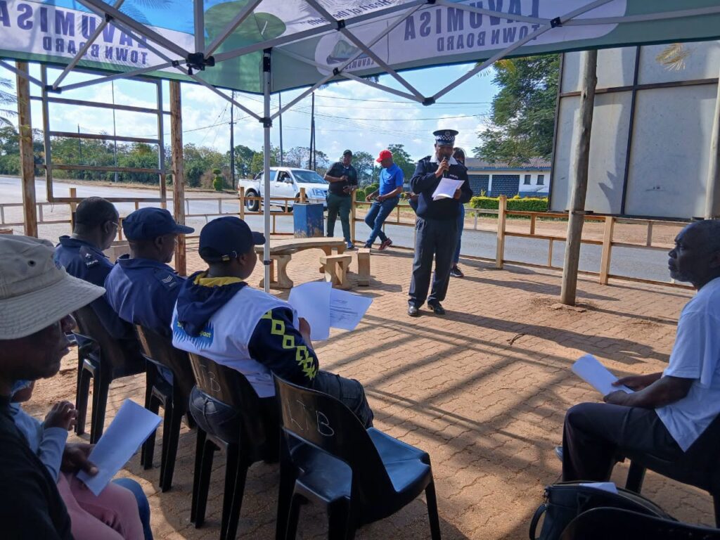 A Royal Eswatini Police Service officer engages with community members during the GBV awareness campaign in Lavumisa. (Photo: REPS)