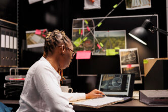 African american private detective studying clues in agency office DC Studio