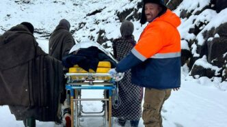 Clifford Tar, known as "Mr Lifesaver," alongside the three shepherds who helped him carry a critically ill pregnant woman on a stretcher through snow at Moteng Pass during Thursday's dramatic rescue operation. | Photo: LENA