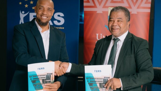 ERS Commissioner General and UNESWA Vice Chancellor Professor Justice M. Thwala exchange signed copies of the Memorandum of Understanding formalising a partnership to deliver specialised AI training for ERS employees through the UNESWA AI Academy. | Photo: ERS