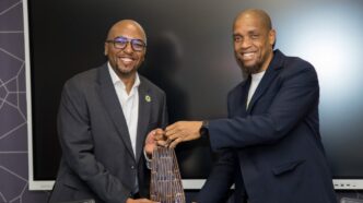 ERS Commissioner General Brightwell Nkambule and FNB Eswatini CEO Thokozani "TK" Dlamini at FNB Head Office following the successful completion of the ERS-FNB payment integration. Photo: ERS