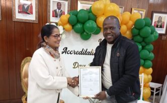The Mayor of Manzini receives an accreditation certificate on behalf of the Municipal Council of Manzini Laboratory during World Accreditation Day commemorations on Friday, June 12, 2026