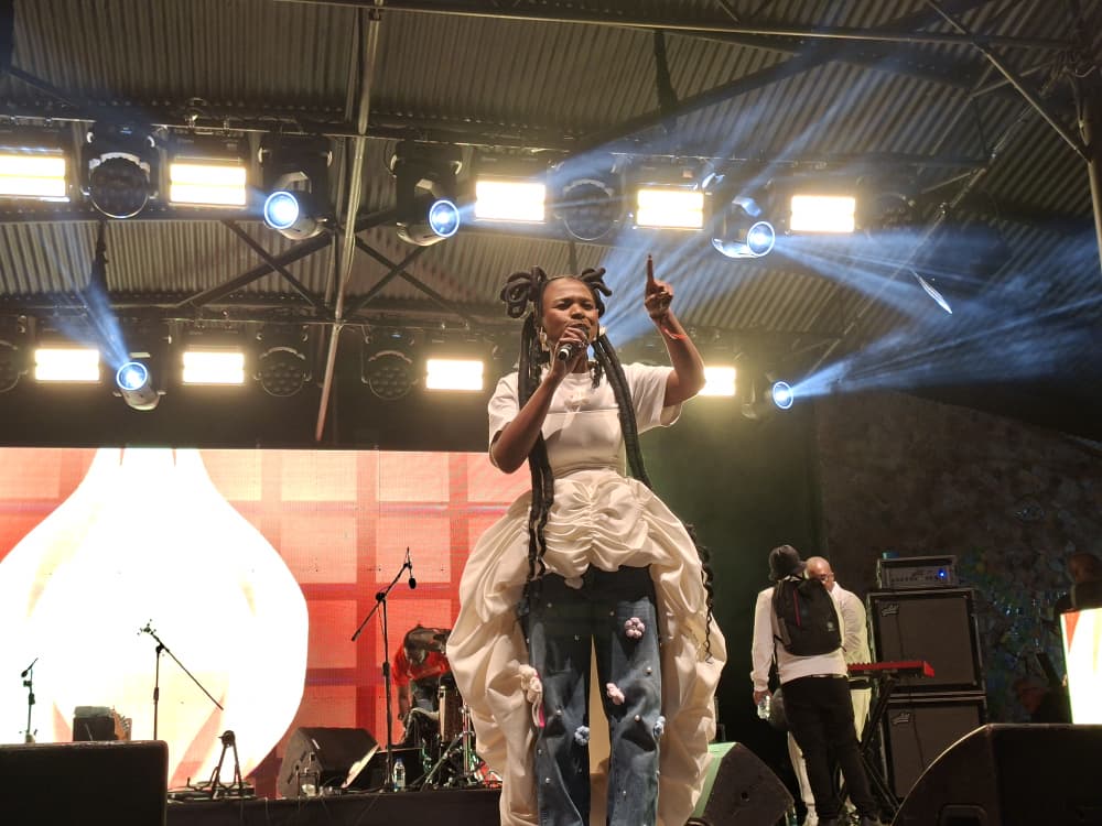 MTN Bushfire Communications Manager Phiwo Dlamini engages festival attendees at the House on Fire venue in Malkerns during MTN Bushfire 2026. | Photo: Adekunle Owolabi
