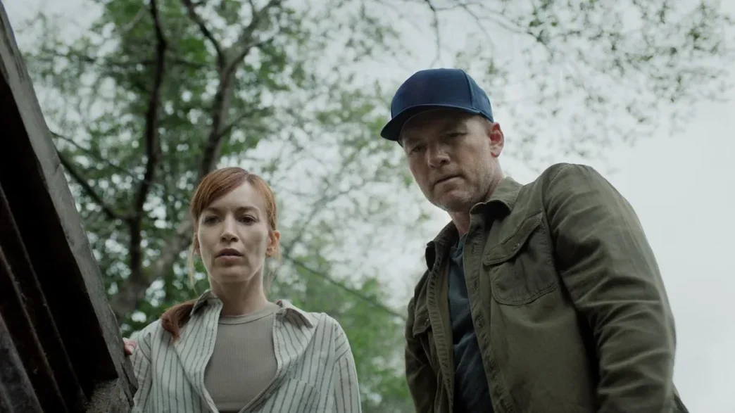 Britt Lower and Sam Worthington in "I Will Find You." (Netflix)