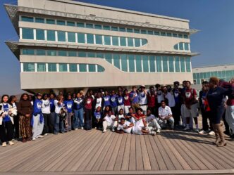 Students from Waterford KaMhlaba pose for a group photograph outside the Royal Science and Technology Park during their learning tour.