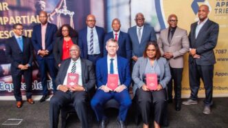 The Minister of Finance, Neal Rijkenberg, joins officials from the Revenue Appeals Tribunal Eswatini (RATE) for a group photo during the launch of the Inaugural Tax Law Reports.