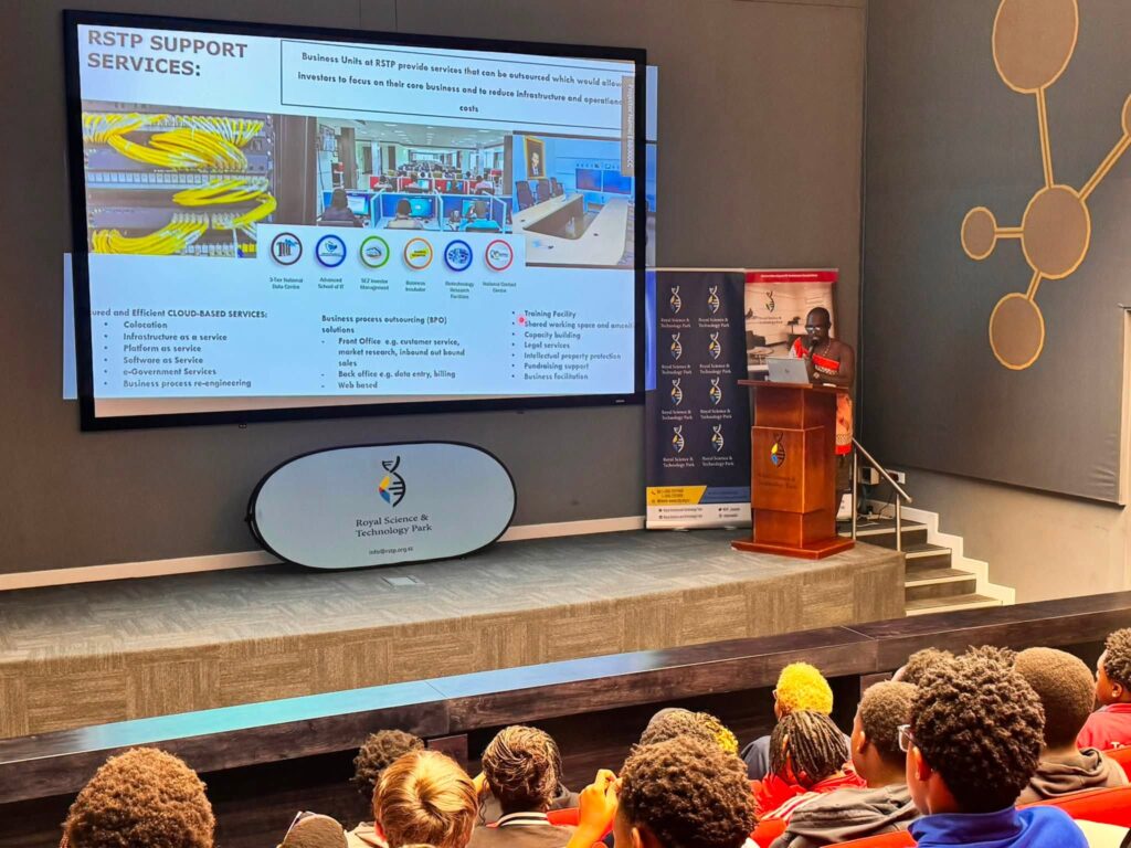 A facilitator takes Waterford KaMhlaba students through the Coders Eswatini initiative and its free online artificial intelligence courses during the tour.