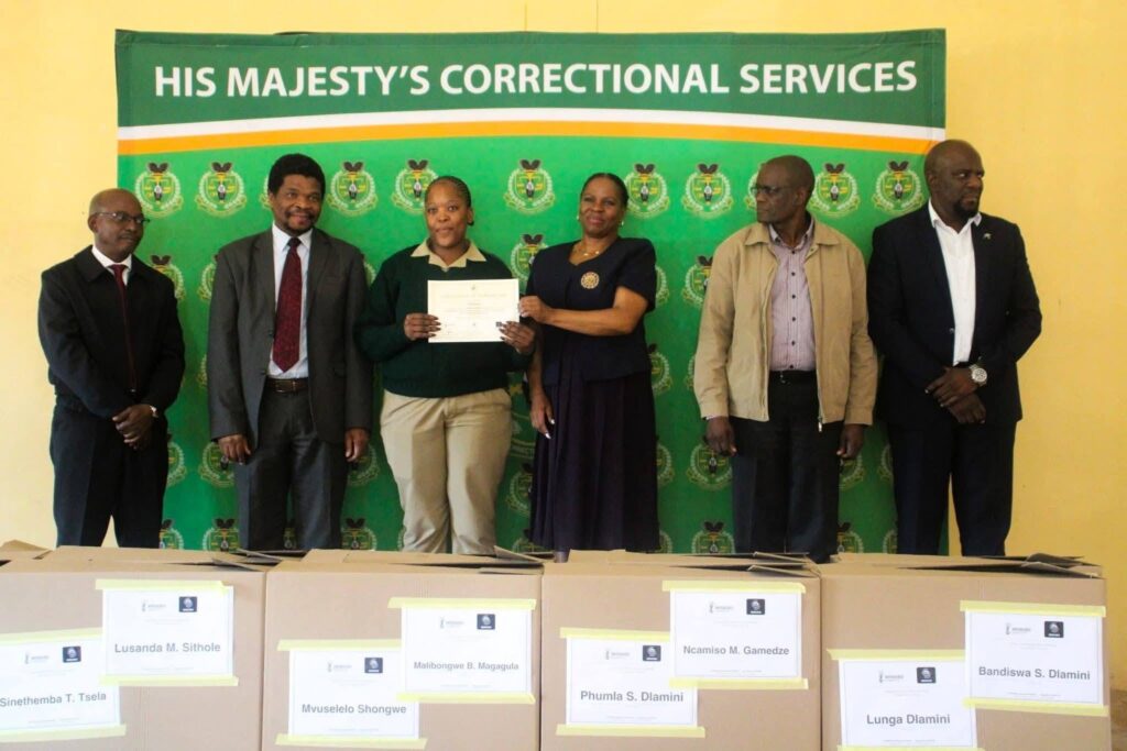 One of the 16 learners receives a certificate and start-up toolkit during the handover of the Mobile Phone Repair Laboratory at Vulamasango School.