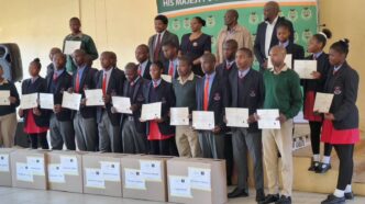 Officials from the Ministry of ICT, His Majesty's Correctional Services and ESCCOM join the 16 learners and newly trained instructors at the handover of the Mobile Phone Repair Laboratory at Vulamasango School.