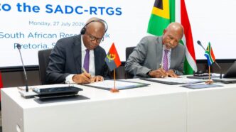 South African Reserve Bank Governor Lesetja Kganyago and Banco Nacional de Angola Governor Manuel Tiago Dias sign documents marking the Angolan kwanza's entry into the SADC RTGS payment system.