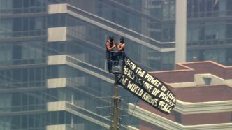 Angela Nikolau and Ivan Kuznetsov, the two climbers who scaled to the top of the Empire State Building on Wednesday. This photo is from October 2025 and appears to show the two in an elevator. From Angela Nikolau