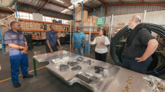 Her Royal Highness Princess Sakhizwe examines locally blown glassware during her visit to Ngwenya Glass, where she engaged artisans on their craft and production process. Photo credit: A Peculiar People