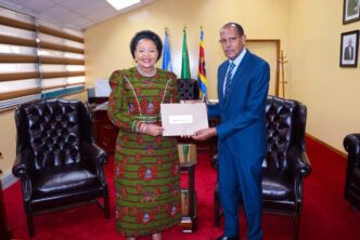 Minister of Foreign Affairs and International Cooperation Senator Pholile Shakantu receives the letter of appointment for Dr. Fekadu Fufa Dinssa as Country Representative for the World Vegetable Center in Eswatini, Thursday.