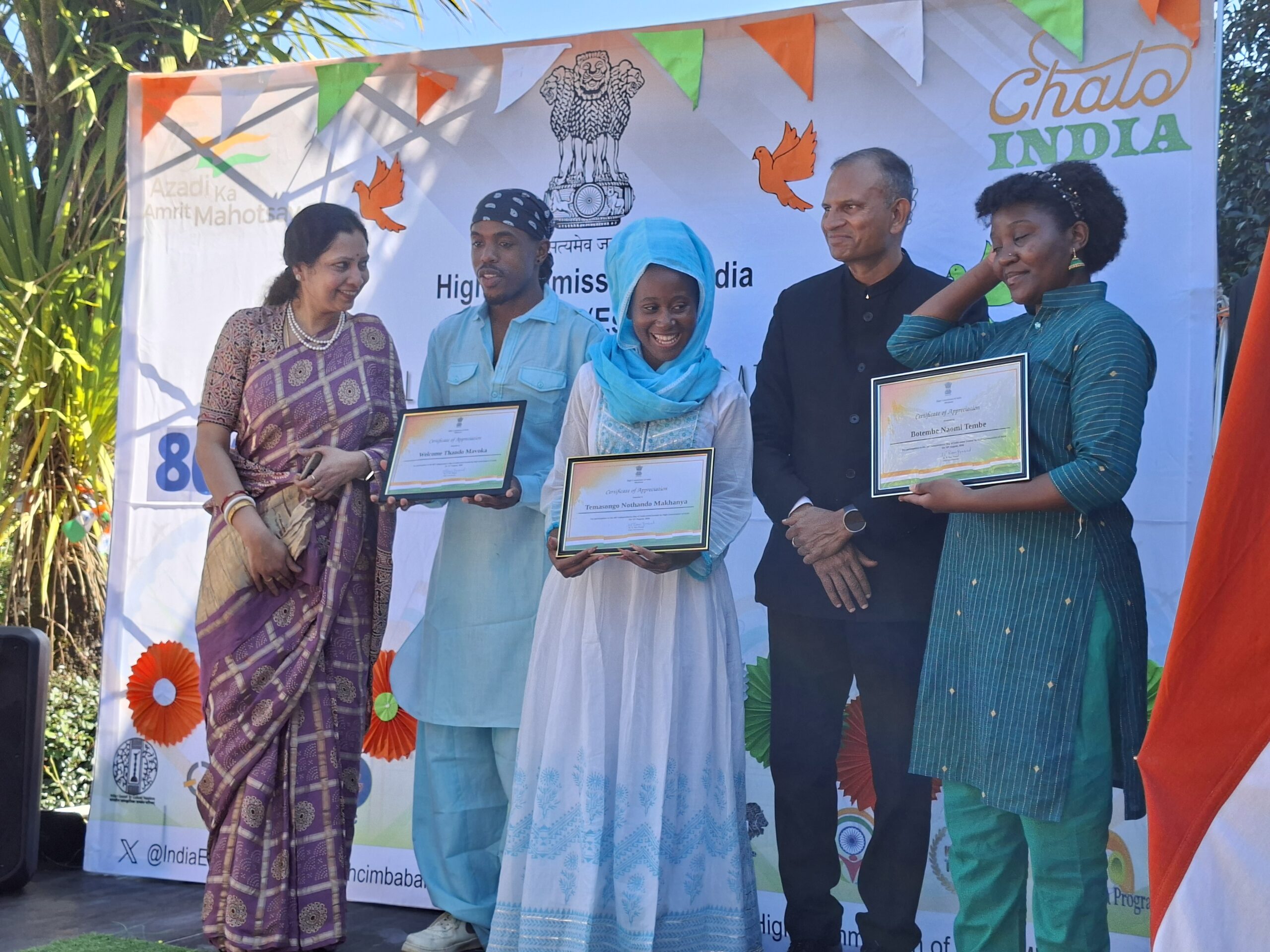 Indian High Commissioner to Eswatini N. Ram Prasad presents certificates to Welcome and his dance group during India’s 80th Independence Day celebrations at India House in Mbabane. Photo: High Commission of India.