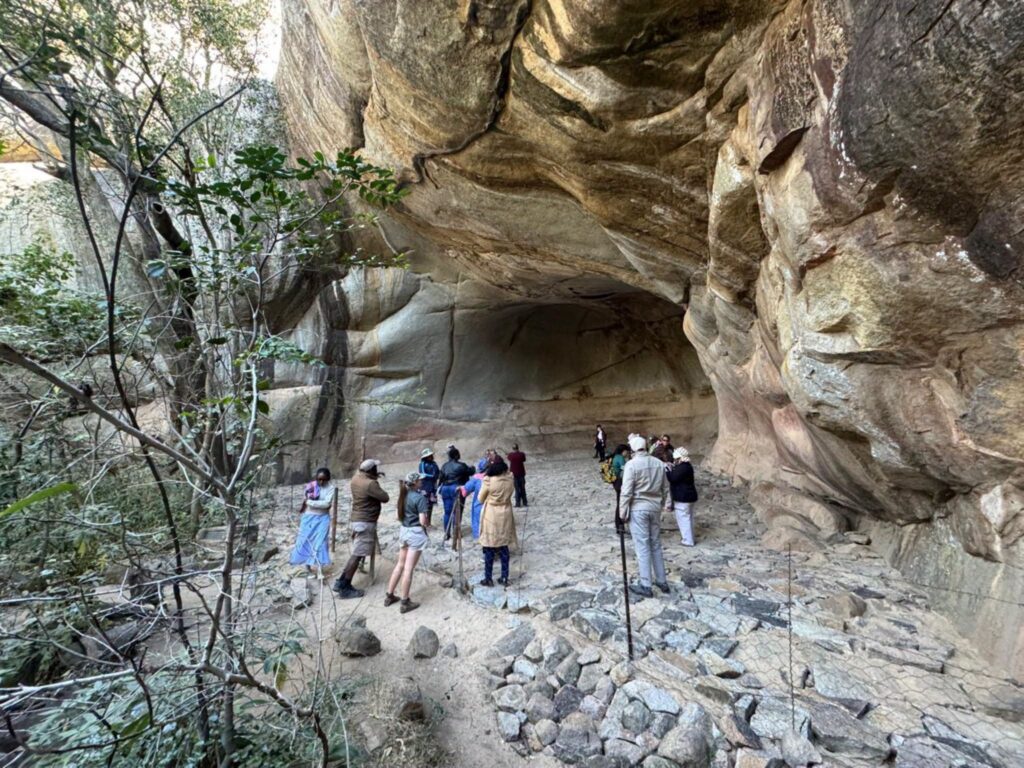 Participants from Botswana, Eswatini, Lesotho, Namibia, South Africa and Zimbabwe pictured during a site visit to Nswatugi and Pomongwe Caves in Matobo Hills, Zimbabwe, as part of a regional training programme on heritage interpretation and storytelling. | Photo: UNESCO ROSA
