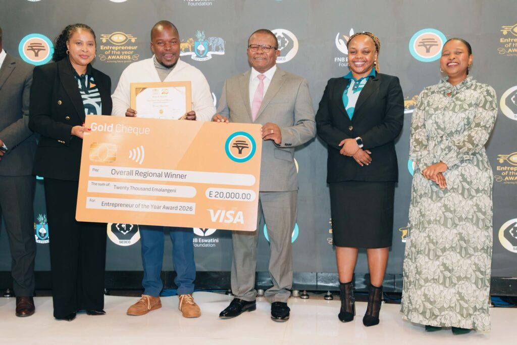 Overall Shiselweni Regional Winner Hlobsile Dlamini of EPower Hardware with Minister of Commerce, Industry and Trade Manqoba Khumalo and key stakeholders after receiving the top regional award. Photo: FNB Eswatini.