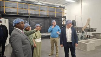 Minister of Commerce, Industry and Trade Manqoba Khumalo tours the Elangeni Macadamia processing facility in Matsapha ahead of the start of full operations.