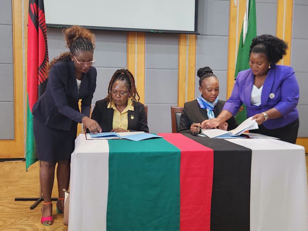 Signing the agreed minutes: Principals from Zambia and Malawi sign the agreed minutes of the inaugural Joint Tourism Technical Committee session in Lilongwe on 6 August 2026. Photo by Ministry of Tourism Zambia.