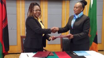 Exchanging the MoU documents: Officials from Zambia and Malawi exchange copies of the reviewed 2018 Memorandum of Understanding on Tourism Cooperation during the closing ceremony in Lilongwe. Photo by Ministry of Tourism Zambia.