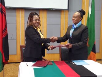 Exchanging the MoU documents: Officials from Zambia and Malawi exchange copies of the reviewed 2018 Memorandum of Understanding on Tourism Cooperation during the closing ceremony in Lilongwe. Photo by Ministry of Tourism Zambia.