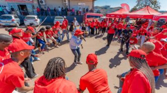 Customers dance during the e-Mali activation event at an Eswatini Mobile service point.