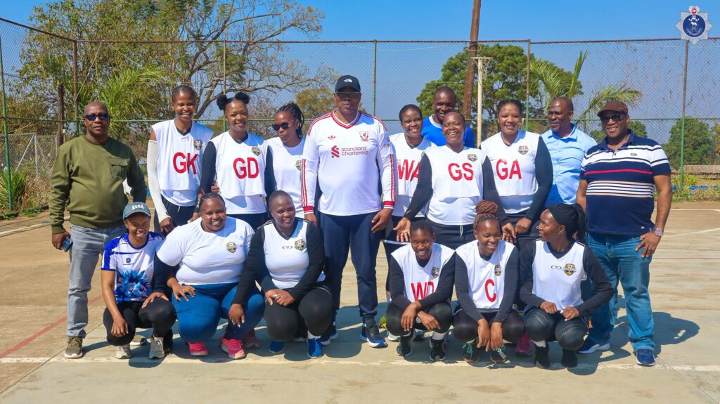 National Commissioner of Police Vusi Manoma Masango joins members of the volleyball team for a photograph during the NATCOM Cup Games.