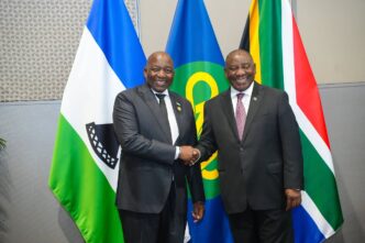 Lesotho Prime Minister Samuel Ntsokoane Matekane shakes hands with South African President Cyril Ramaphosa during bilateral talks in Durban, South Africa, on Sunday.