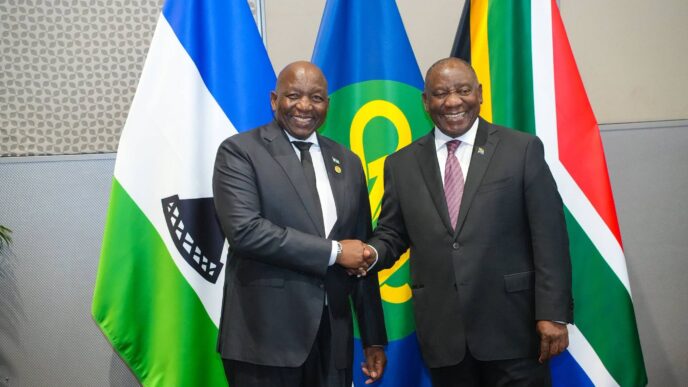Lesotho Prime Minister Samuel Ntsokoane Matekane shakes hands with South African President Cyril Ramaphosa during bilateral talks in Durban, South Africa, on Sunday.
