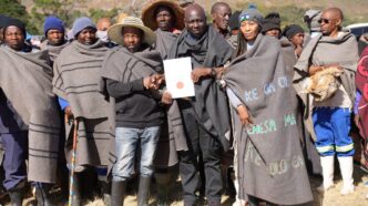 Minister of Environment and Forestry Thabo Mofosi joins pastoralists and livestock farmers for a group photograph during the commemoration of the International Year of Rangelands and Pastoralists at Ha ’Matsa, Matelile, Mafeteng, Lesotho.