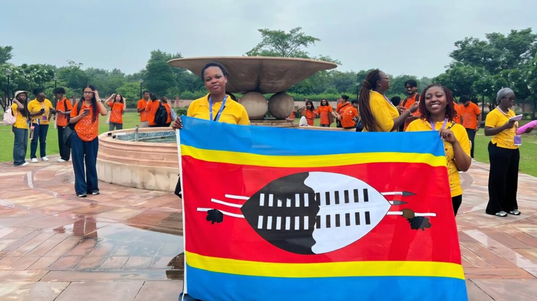 Tiyandza Melokuhle Ndlovu and Nokulindwa Annie Dlamini proudly hold the Eswatini flag during Mission ShakthiSAT in India.