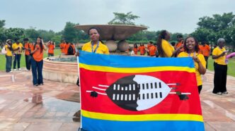 Tiyandza Melokuhle Ndlovu and Nokulindwa Annie Dlamini proudly hold the Eswatini flag during Mission ShakthiSAT in India.