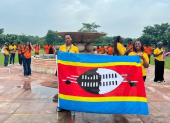 Tiyandza Melokuhle Ndlovu and Nokulindwa Annie Dlamini proudly hold the Eswatini flag during Mission ShakthiSAT in India.