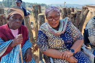 Deputy Prime Minister Thulisile Dladla hands over the keys to one of the beneficiaries during the official handover of new homes. Photo: DPMO.