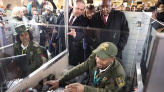 President Cyril Ramaphosa and Home Affairs Minister Dr Leon Schreiber look on as a Border Management Authority official demonstrates South Africa’s new Electronic Travel Authorisation system. 📸 Photo: Gauteng Tourism Authority