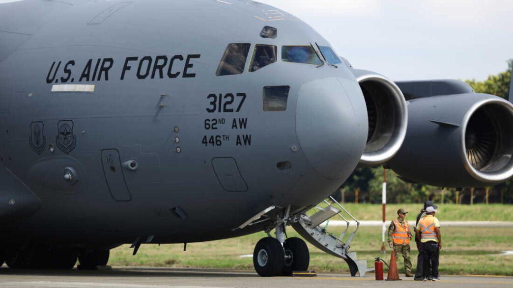 SAN PEDRO SULA, HONDURAS - JANUARY 31: US Air force flight carrying deported migrants by the US government arrive at Ramon Villeda Morales International Airport on January 31, 2025 in San Pedro Sula, Honduras. Honduras receives 126 migrants in two different flights as part of mass deportation plans by the Trump's administration. People were captured once they got into the US or during the raids conducted by the authorities. (Photo by Jorge Salvador Cabrera/Getty Images)