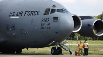 SAN PEDRO SULA, HONDURAS - JANUARY 31: US Air force flight carrying deported migrants by the US government arrive at Ramon Villeda Morales International Airport on January 31, 2025 in San Pedro Sula, Honduras. Honduras receives 126 migrants in two different flights as part of mass deportation plans by the Trump's administration. People were captured once they got into the US or during the raids conducted by the authorities. (Photo by Jorge Salvador Cabrera/Getty Images)