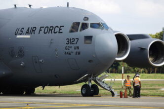 SAN PEDRO SULA, HONDURAS - JANUARY 31: US Air force flight carrying deported migrants by the US government arrive at Ramon Villeda Morales International Airport on January 31, 2025 in San Pedro Sula, Honduras. Honduras receives 126 migrants in two different flights as part of mass deportation plans by the Trump's administration. People were captured once they got into the US or during the raids conducted by the authorities. (Photo by Jorge Salvador Cabrera/Getty Images)