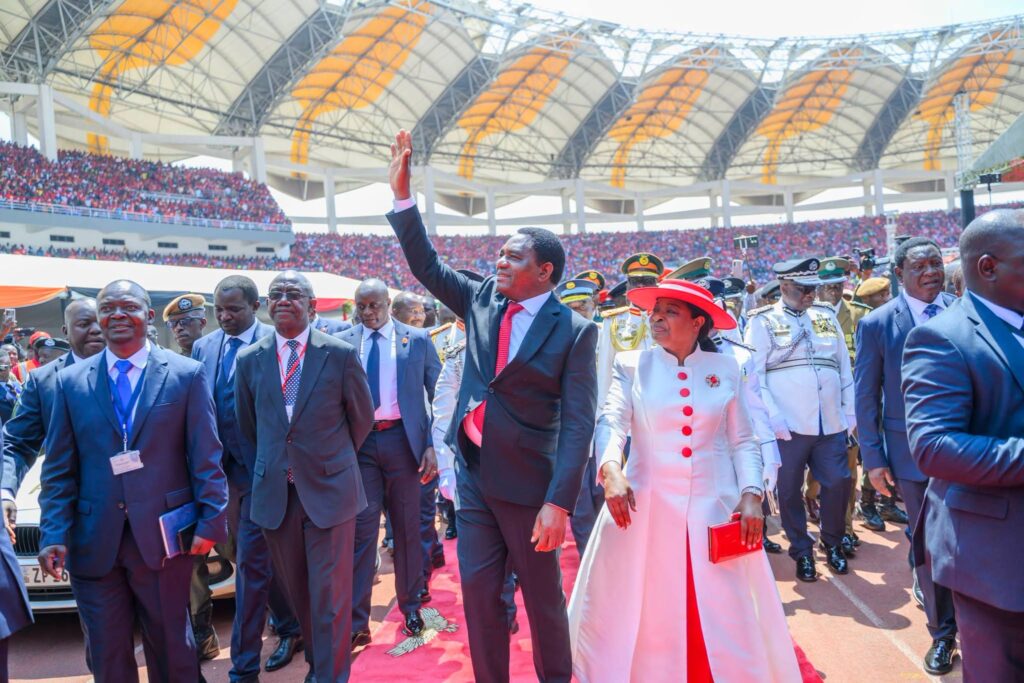 President Hakainde Hichilema walks with First Lady Mutinta Hichilema during the inauguration ceremony in Lusaka.